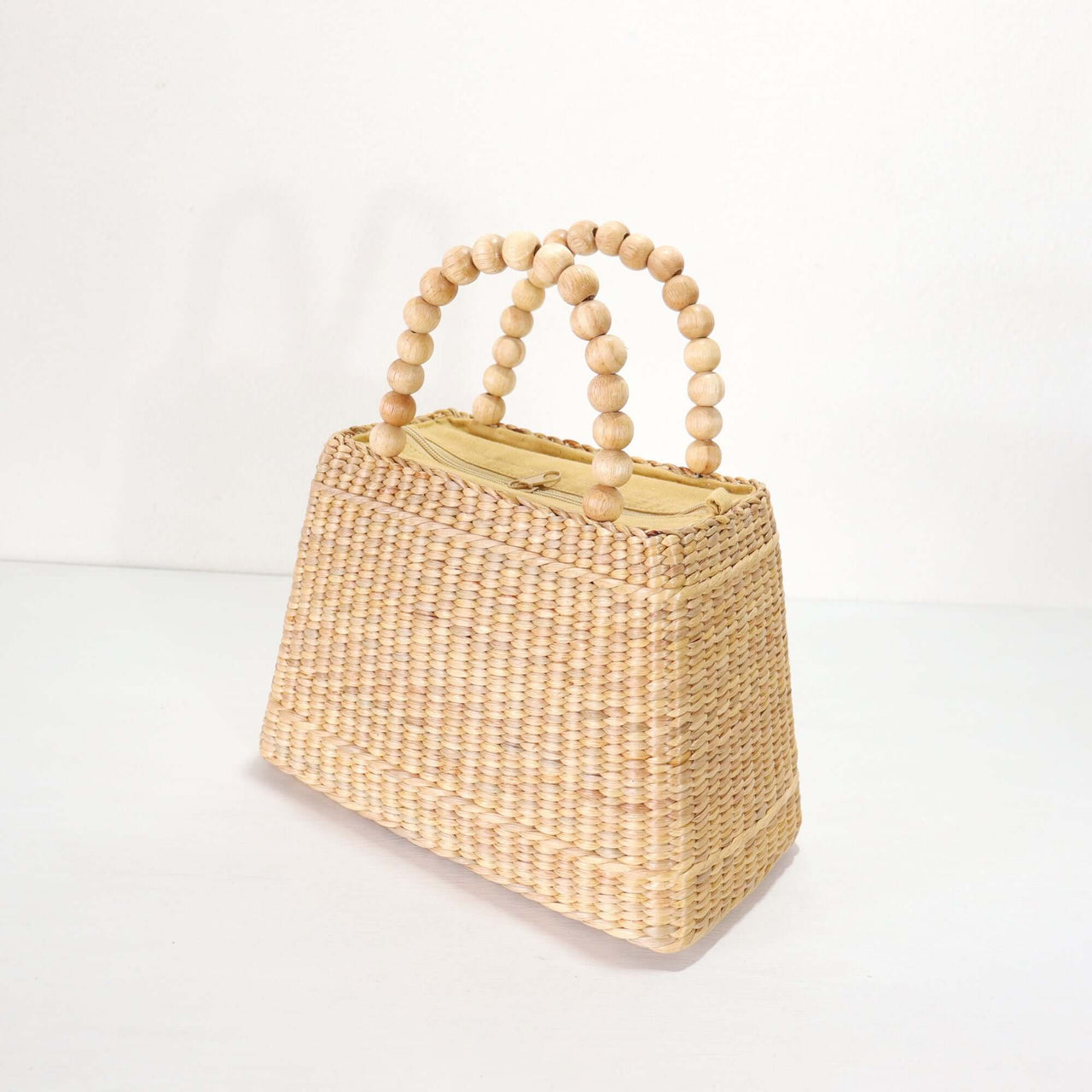CHALA — handwoven straw handbag with a soft, natural weave