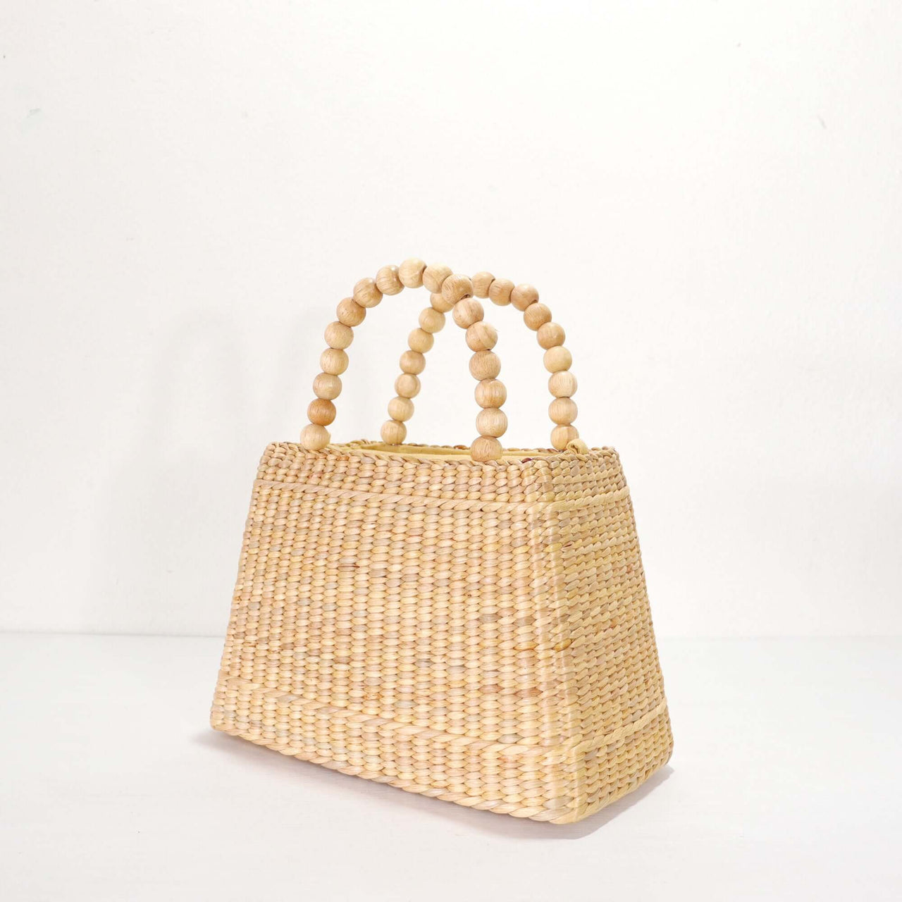 CHALA — straw handbag styled for summer beach outings