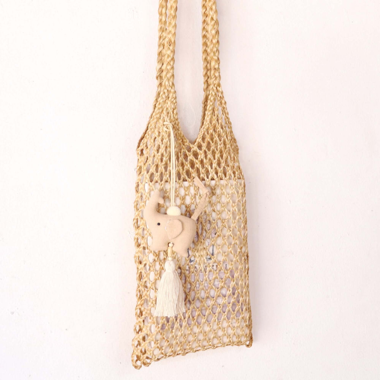 KADARA — handwoven tassel bag charm with a natural boho finish