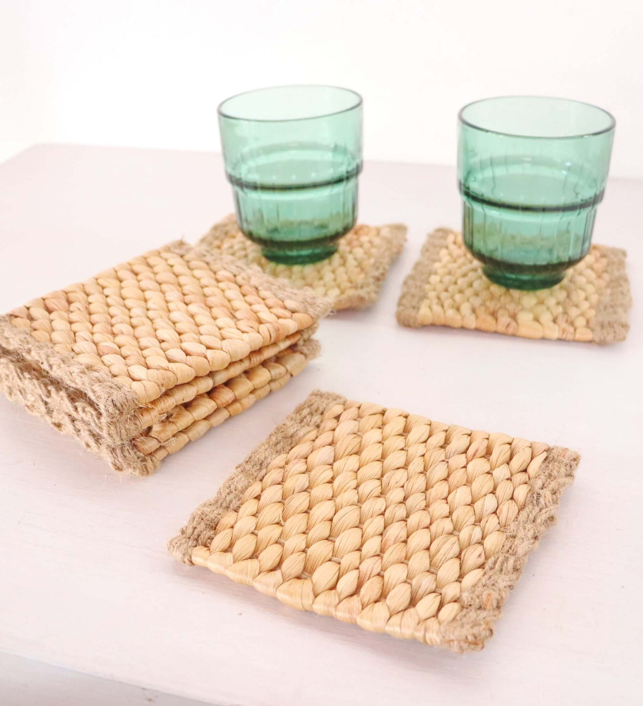 KA NOK PUN Water Hyacinth Boho Coaster Set of 4 featuring handwoven coasters with rustic jute edges.