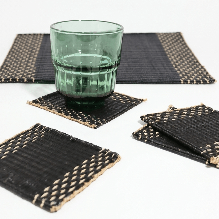Lavila Handwoven Coaster Set of 4 featuring black woven centers with natural edges, ideal for modern and minimalist decor.