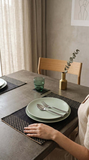 Lavila Handwoven Placemat displayed on a modern dining table with minimalist decor and plates.