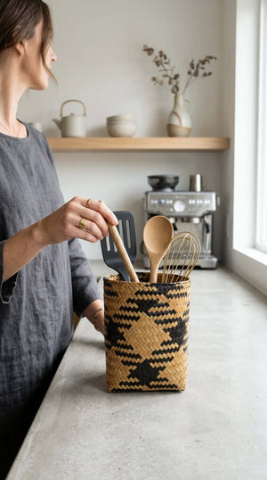 ROM RA WIN Wicker Utensil Basket (Set of 2) filled with cooking utensils on a kitchen counter.